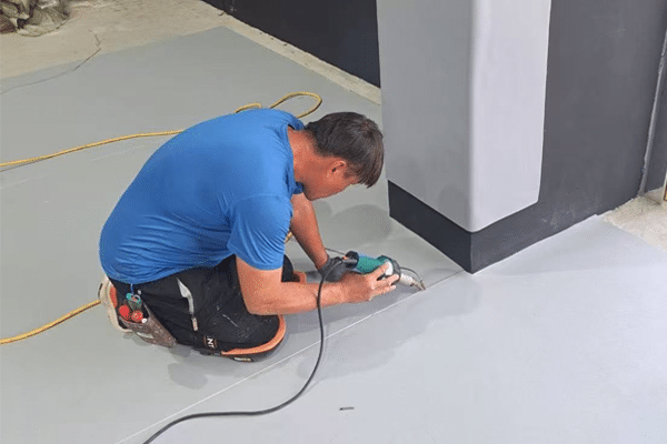 Professional heat welding installation of roll-out pickleball flooring